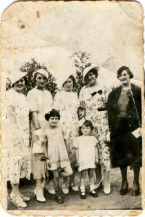 Tili Solomon as a child with relatives and friends